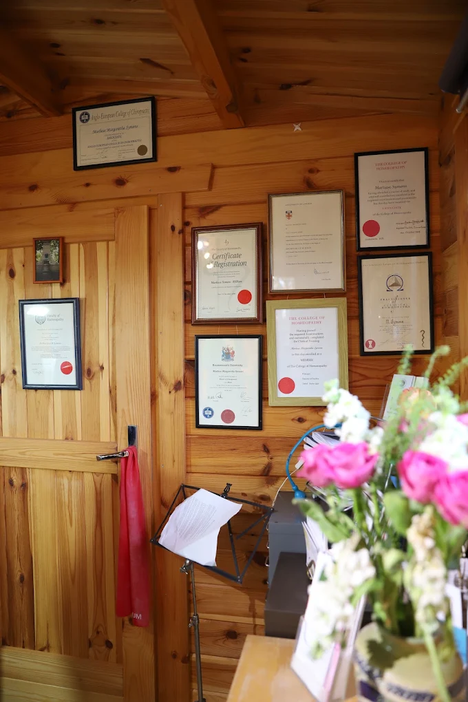 Backin2Health clinic interior with certifications and qualifications